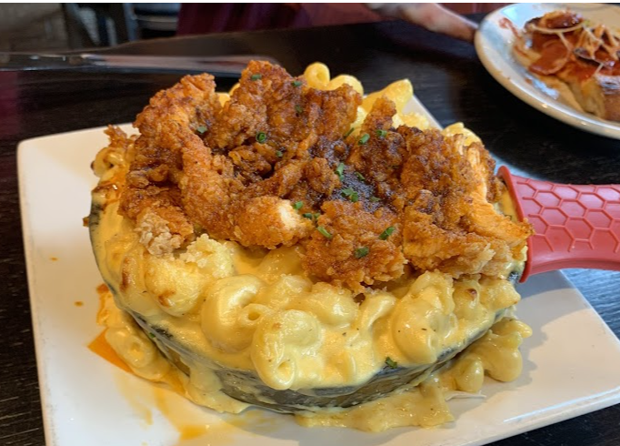 The Stillery signature dishes Hot Chicken Mac & Cheese Jalapeno Bacon RangoonsPretzel Burger